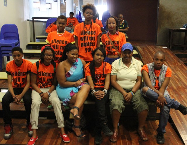 The crew featuring Charmain Carrol (blue dress) and Funeka Soldaat (light yellow polo t-shirt)