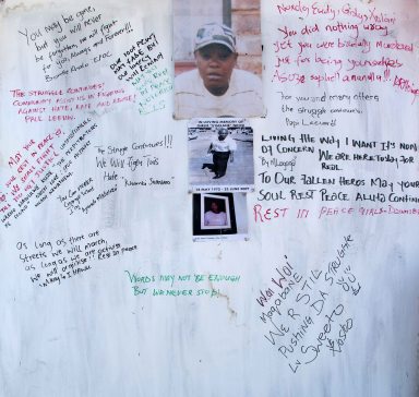 Messages of support written on a hard painted wood