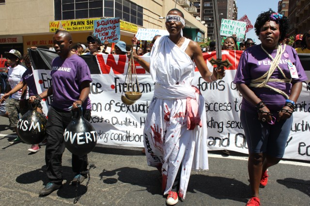Our activist and performing artist, Thokozani Ndaba leading Johannesburg People’s Pride as Raped Lady Justice. © Collen Mfazwe & Xana Nyilenda