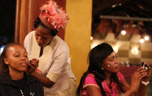 Zami being painted after dinner at Moyo's...