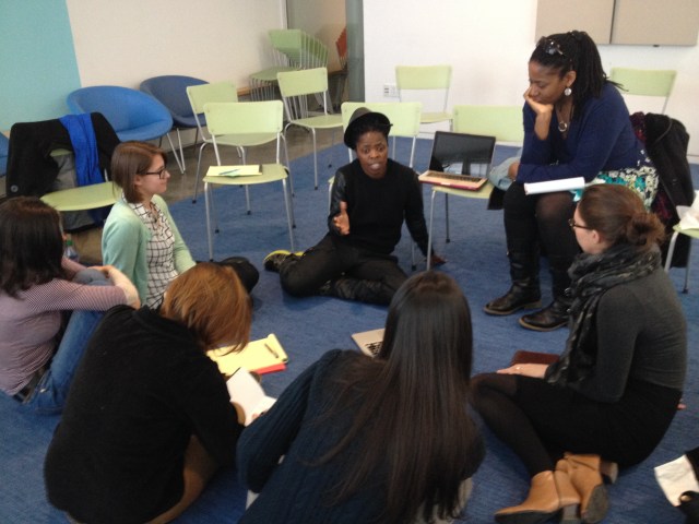 On 3 Feb.2014: Muholi addressed some students at Smith College, seated on the chair is Professor Barnes listening attentively. © Maurita Poole (iPhone 5 photo)