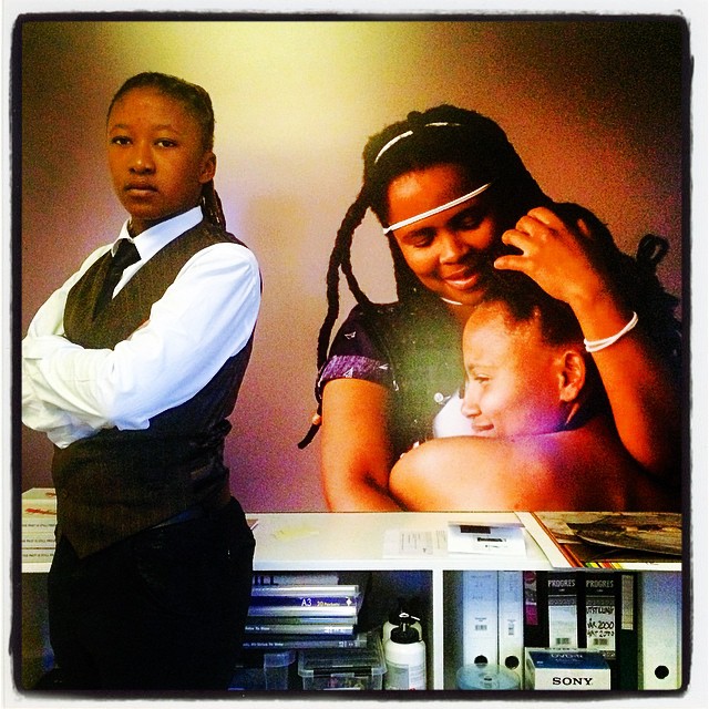 Shaz aka Sicka Star-ban Jones posing in front of the photos to be on exhibition featuring Siba & Christie. Photo by Zanele Muholi (2015/02/18)