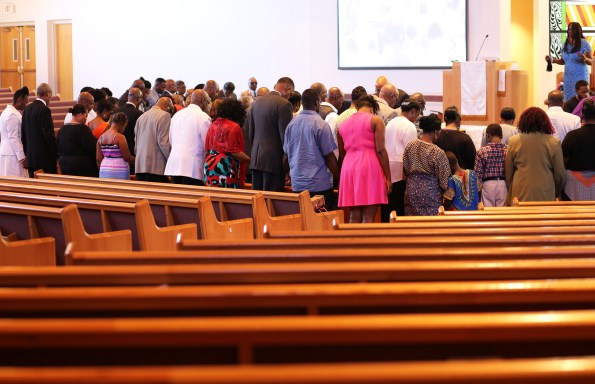 2015 Aug. 9 BBC congregants praying_0637